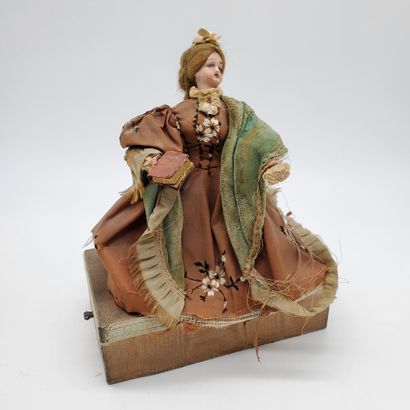 null MUSIC BOX topped by a doll with a porcelain head

Beginning of XXth century...