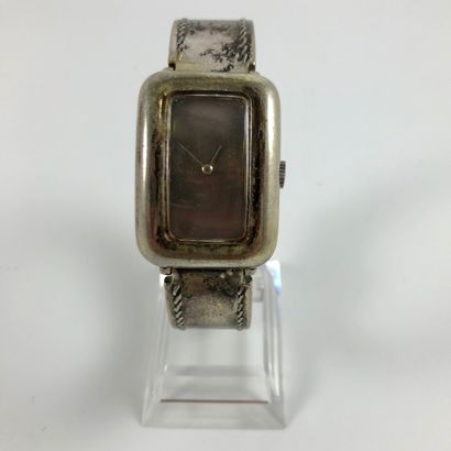 null OREY PARIS Rectangular watch in silver. Curvex case. Smooth petroleum dial without...