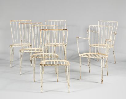 WORK OF THE 1950's Suite of ten chairs and pair of armchairs in wrought iron lacquered...