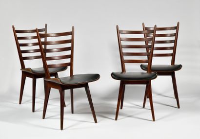 null WORK OF THE 1950S Suite of four chairs with flared backs and five curved bands,...