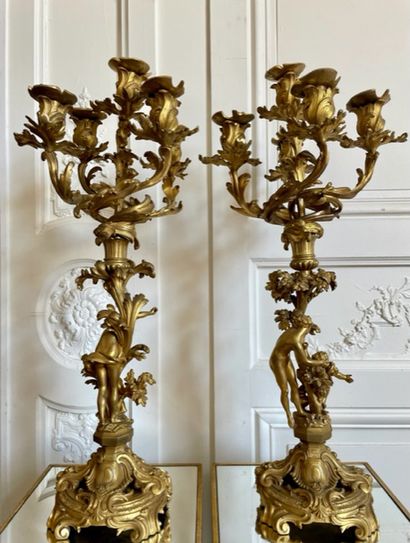 null PAIR OF CANDELABRES in gilded and chased bronze with five moving arms of lights,...