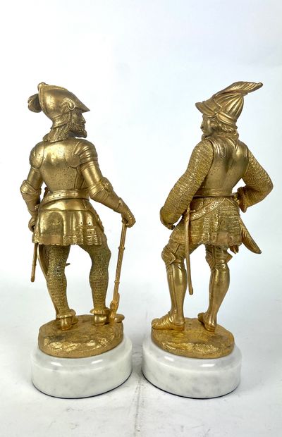 null FRENCH SCHOOL of the XIXth century Men in armor Pair of gilded bronzes on white...