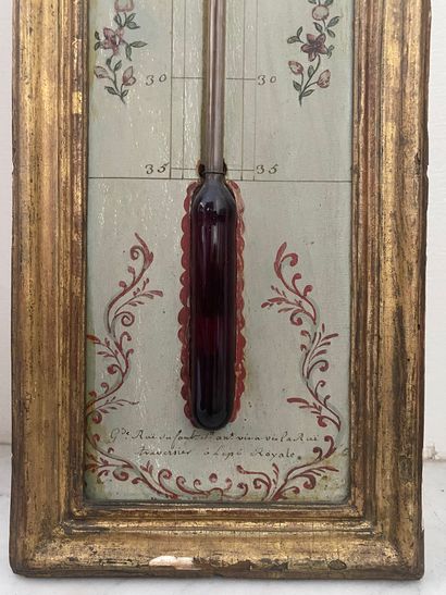 null BAROMETER and THERMOMETER in painted and gilded wood. Signed ROC in Paris. Louis...