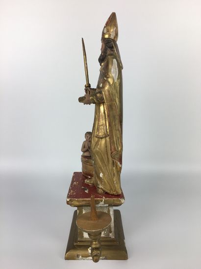 null Gilded and lacquered wood candlestick representing Saint Nicolas. 19th century...