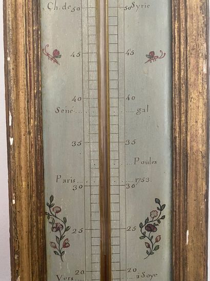 null BAROMETER and THERMOMETER in painted and gilded wood. Signed ROC in Paris. Louis...