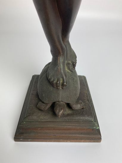 null Eugène DELAPLANCHE (1836-1891) Young boy on a turtle. Bronze with brown patina...