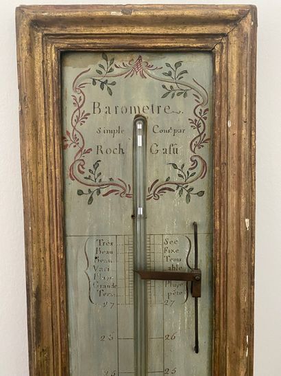 null BAROMETER and THERMOMETER in painted and gilded wood. Signed ROC in Paris. Louis...
