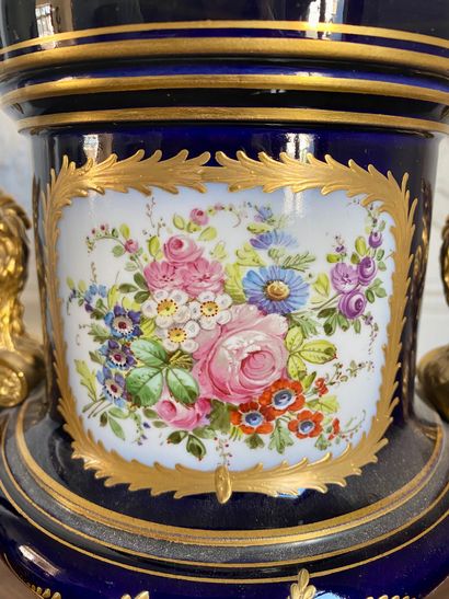 null SEVRES (In the taste of) Vase on pedestal mounted in blue and gold porcelain...