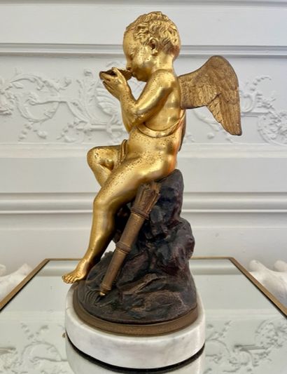 null GROUPE in gilded and patinated bronze decorated with a Love sitting on a rock...