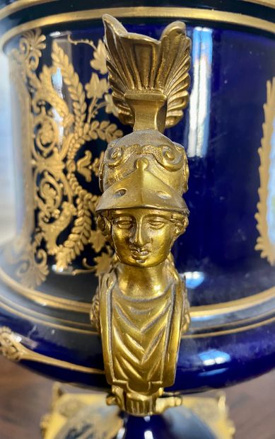 null SEVRES (In the taste of) Vase on pedestal mounted in blue and gold porcelain...