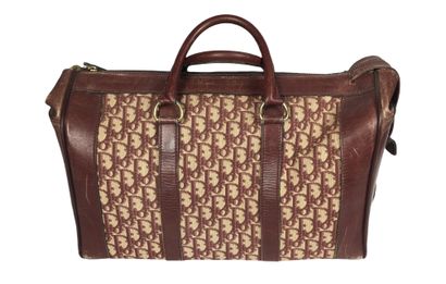 null DIOR Travel bag in burgundy leather and monogrammed canvas. 25 x 40 cm (scratches...