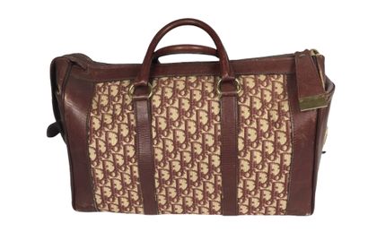 DIOR Travel bag in burgundy leather and monogrammed...