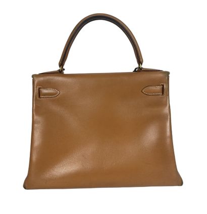 null HERMES PARIS Kelly bag 28 cm in camel box with gold metal hardware. Wear to...
