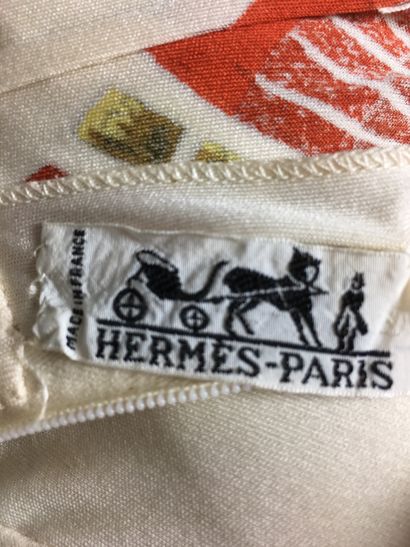  HERMES PARIS Two light sweaters with high collars, one beige with golden plant motifs,...