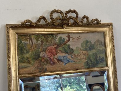 null TRUMEAU Style Louis XVI, surmonté d'une peinture à scène pastorale.

Cadre en...
