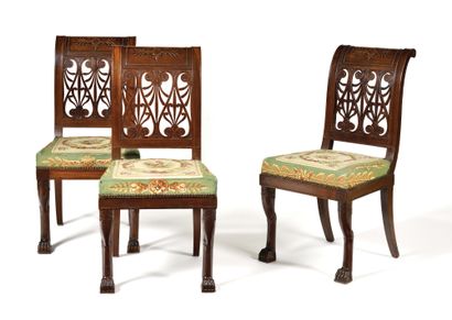 null 
SET OF THREE mahogany and mahogany veneer chairs with upside down backs decorated...