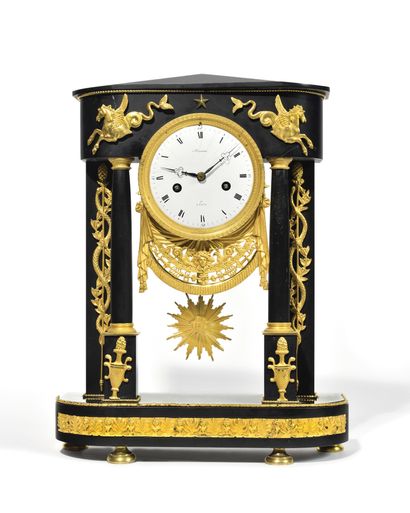 null PORTICAL CLOCK in black marble decorated with gilded and chased bronzes. The...