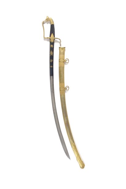 null CAVALRY OFFICER'S SABER. Handle in squared ebony. Mounting in gilded brass,...