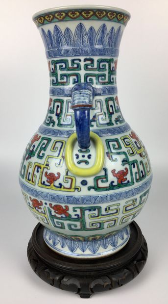 null CHINA

Polychrome enamelled porcelain baluster vase, the handles with stylized...