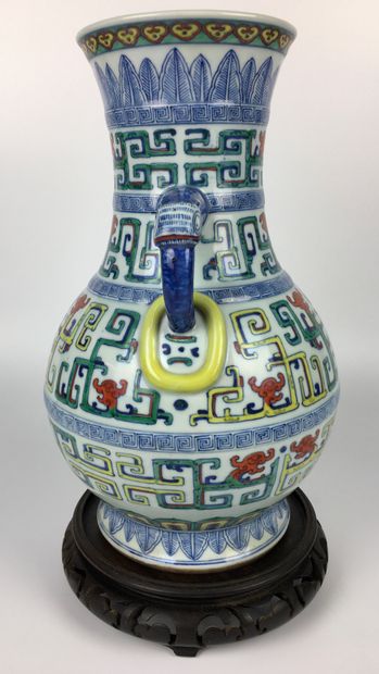 null CHINA

Polychrome enamelled porcelain baluster vase, the handles with stylized...