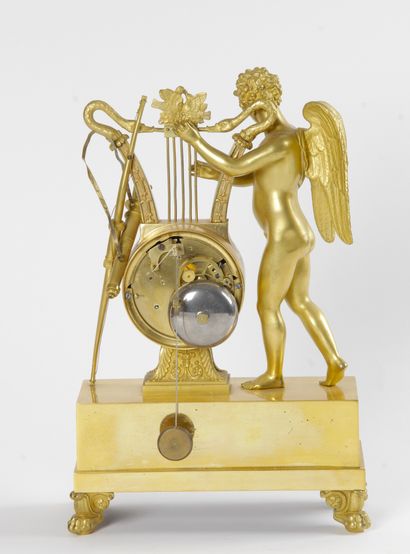 null HANGER, in chased and gilded bronze representing a musical genius playing the...