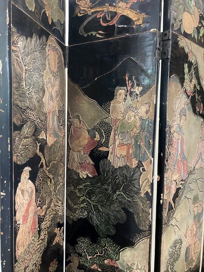 null CHINA, COROMANDEL 9-panel screen in black lacquered wood decorated with a landscape...