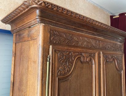 null LARGE NORMANDE CABINET in molded and carved wood opening by two doors, carved...
