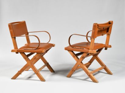null JACQUES ADNET (1900-1984)

Suite de quatre fauteuils en frêne à piètement en...