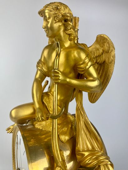 null 
Hanging lamp in chased and gilded bronze, representing Cupid cutting his bow...
