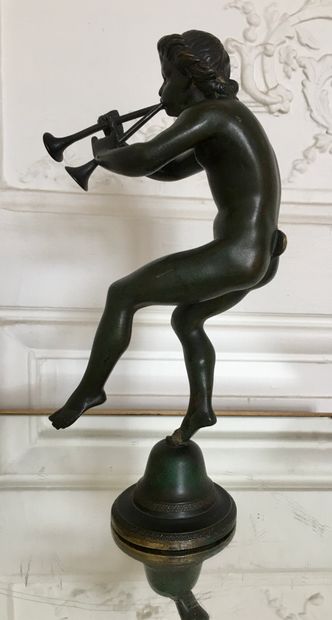 null FROM THE ANTIQUE 

The trumpeting faun 

Bronze with green patina 

Inscription...