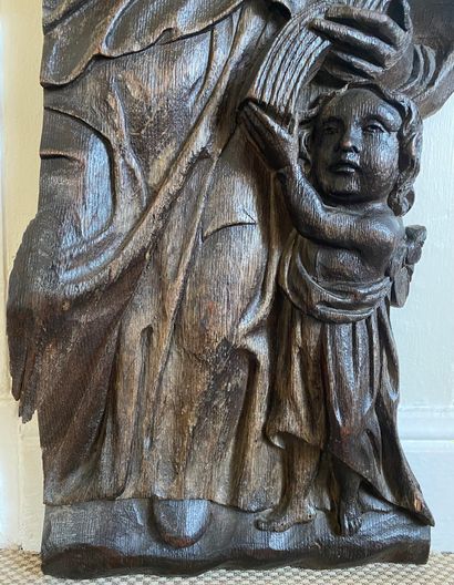 null Carved oak bas-relief decorated with a Saint reading supported by a child

(Fragment)

62...