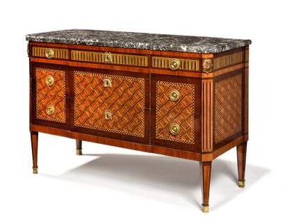 null COMMODE 

in geometrical marquetry opening five drawers on three rows, the top...