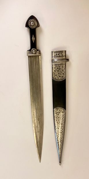 null KINDJAL with its original scabbard

Steel, silver, tchern, leather, bone

Signature...