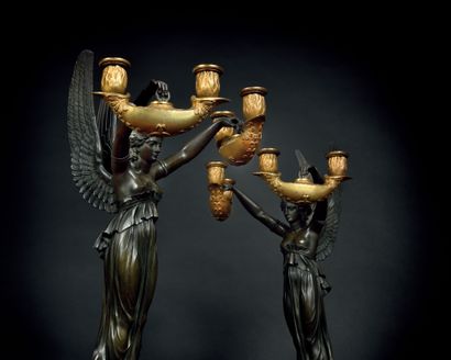 null PAIR OF CANDELABRA

with four lights, in patinated bronze and gilded bronze...