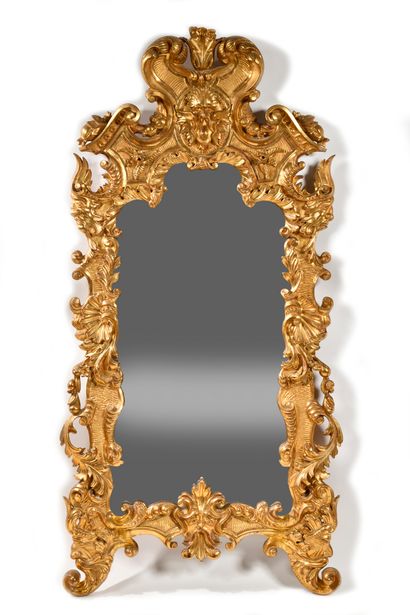 LARGE MIRROR 
in gilded wood with contoured...