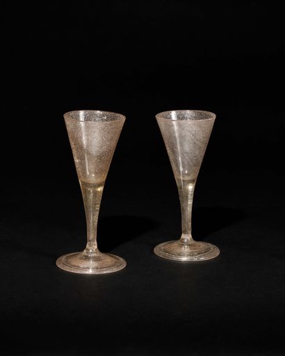 TWO GLASSES 
in blown glass with a pink background,...
