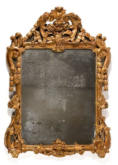 MIRROR WITH A PARE-CLOSE 
in richly carved...