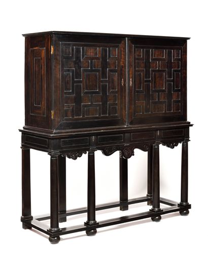 null CABINET IN EBONY
molded opening to two drawers and two leaves discovering fourteen...