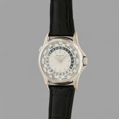 null PATEK PHILIPPE
"World Time
Ref : 5110G. 
Circa : 2000.
Bracelet watch in white...
