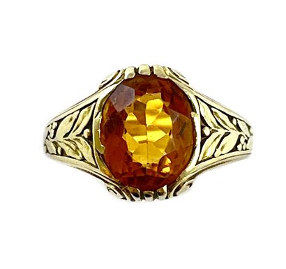 null RING

holding an oval beryl in a plant decoration. Mounted in 14K yellow gold....