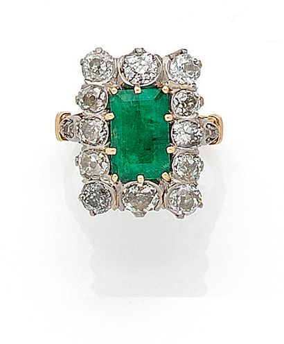 null RING 

holding a rectangular emerald of about 2 carats in a setting of old cut...