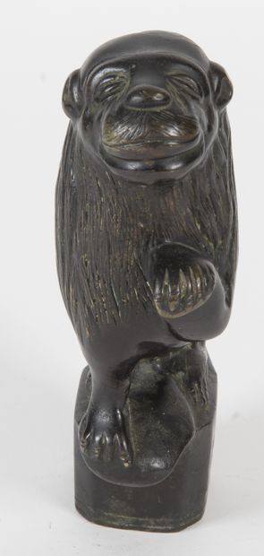 null Lion in bronze with black patina, element, represented seated, left forepaw...