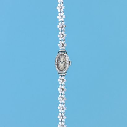 null ART DECO WATCH
Circa: 1930.
Art deco bracelet watch in platinum. Oval case set...