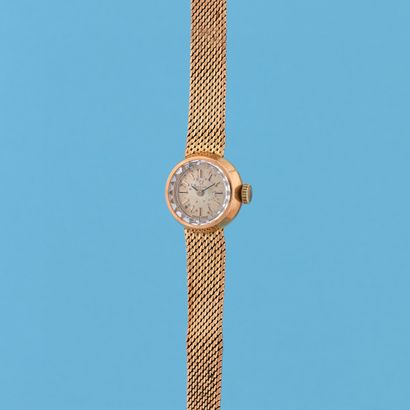 null OMEGA 
Circa: 1960. 
Lady's watch in yellow gold 750/1000. Round case. Gold...