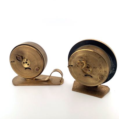 null YEMA 

Set of 2 golden metal yema alarm clocks. 

One of round shape with white...