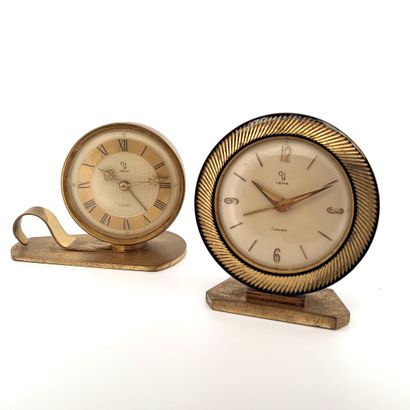 null YEMA 

Set of 2 golden metal yema alarm clocks. 

One of round shape with white...