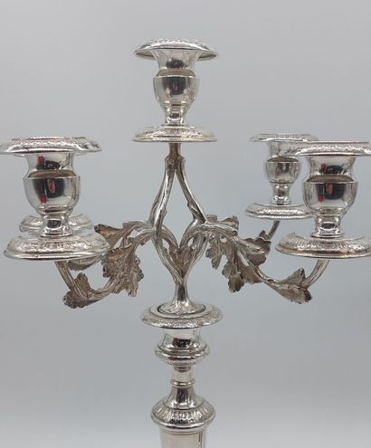 null Pair of candlesticks in silver plated metal chased with leaves, five candles...