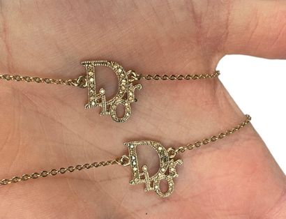null DIOR
Necklace and bracelet in gold metal and rhinestones with the house logo...
