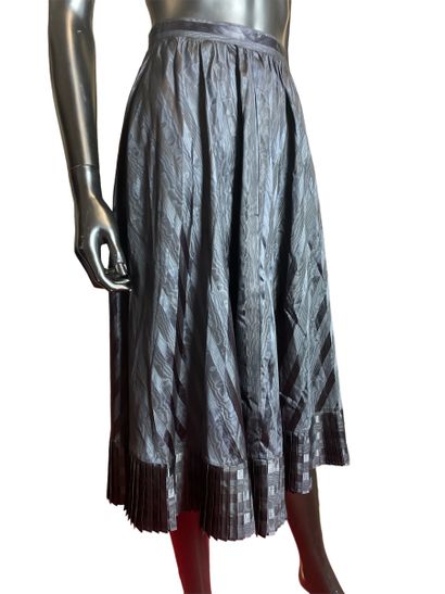 null CACHAREL 
Long black skirt in iridescent striped fabric, pleated flounce at...