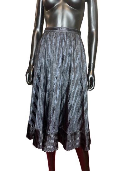 null CACHAREL 
Long black skirt in iridescent striped fabric, pleated flounce at...